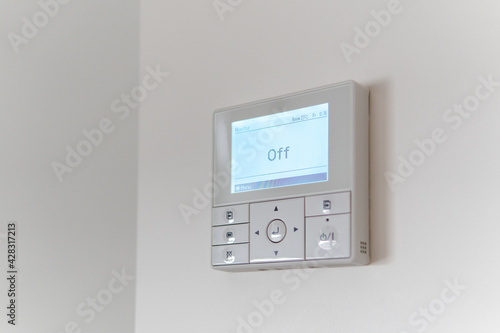 Air conditioning controller on the wall that shows off