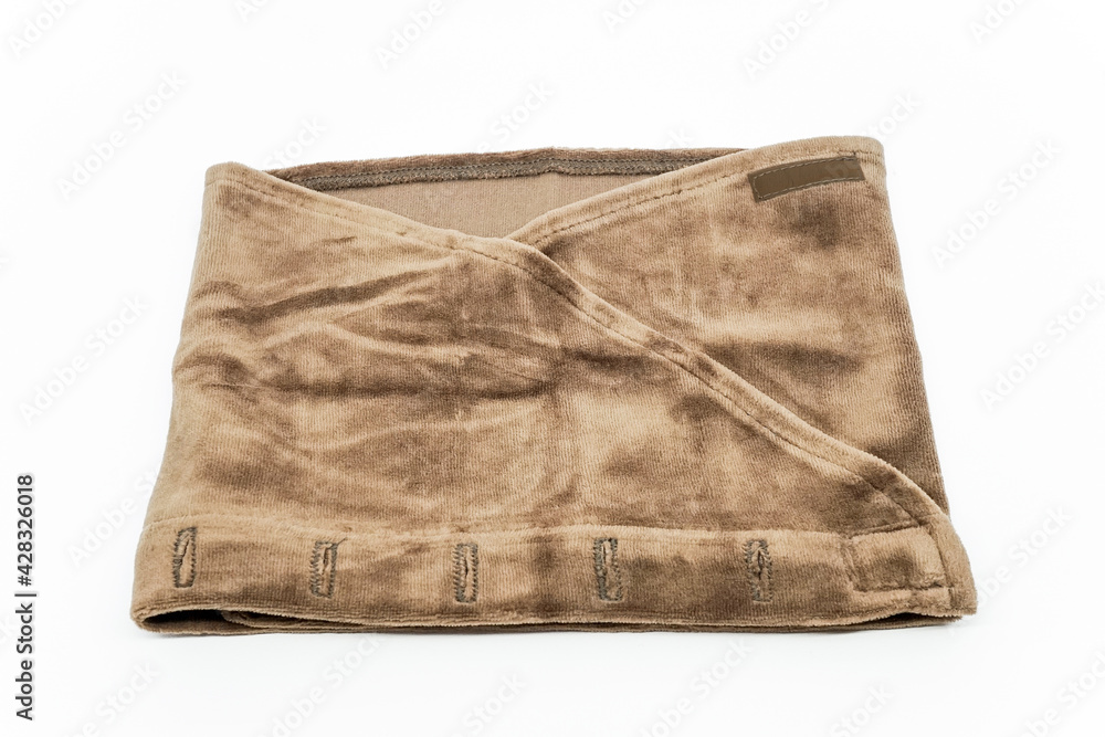 Brown towel headband for eyelash extension treatment on white background. Brown towel headband for eyelash extension treatment on white background.