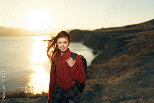 woman hiker outdoors rocky mountains landscape sun vacation