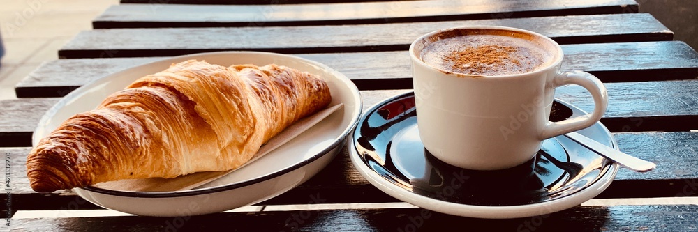 cup of coffee and croissant banner cup of coffee and croissant banner