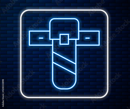Glowing neon line Knife holster icon isolated on brick wall background. Vector