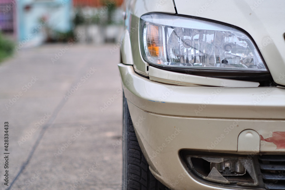 The damaged cover headlights of the car broke because of an accident, fog lamp broken, repair concept
