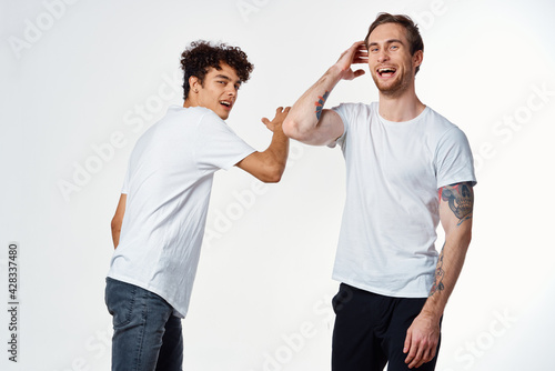 two man in white t-shirts emotions friendship fun