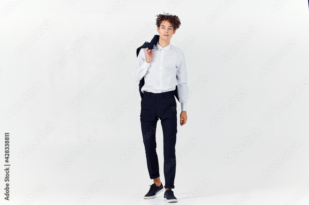 business man with a jacket in his hands fashion self-confidence full growth