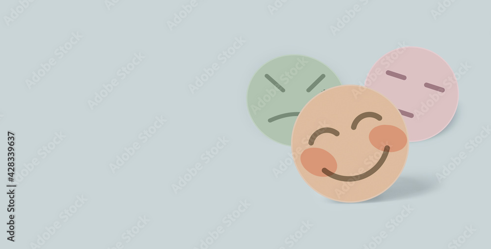 Nude color paper cut happy smile face on blue background , positive thinking, mental health assessment , world mental health day concept Nude color paper cut happy smile face on blue background , positive thinking, mental health assessment , world mental health day concept