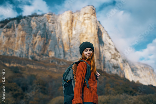 woman backpacker on nature mountains landscape on vacation travel