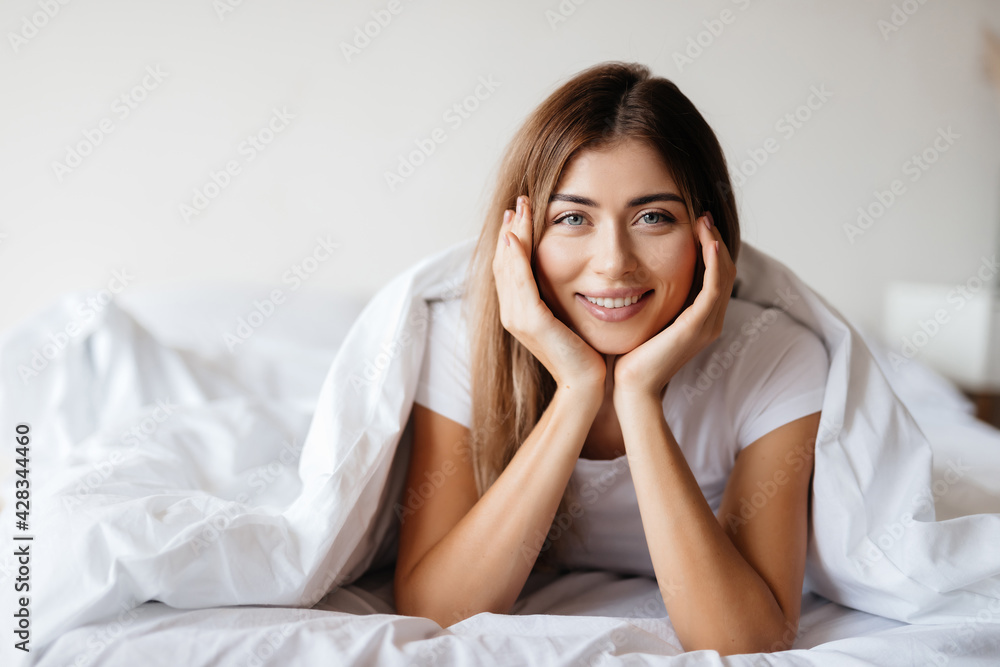 Calm beautiful woman having a lie-in in the morning Calm beautiful woman having a lie-in in the morning