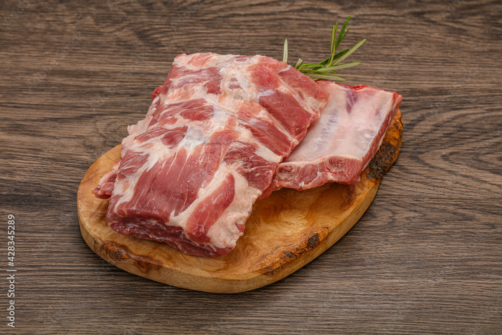 Raw pork ribs served rosemary Raw pork ribs served rosemary