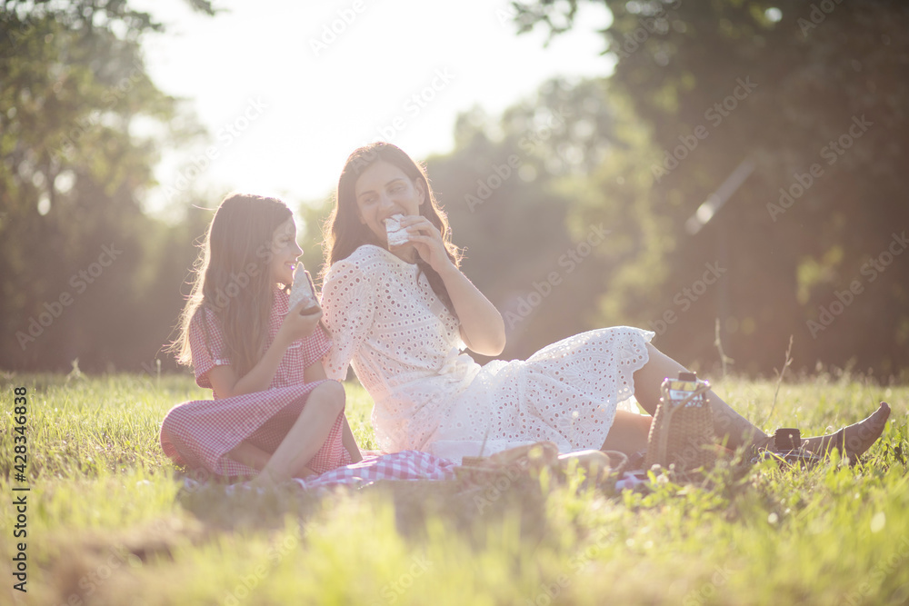 Fototapeta premium This is our perfect day. Mother and daughter at the park.