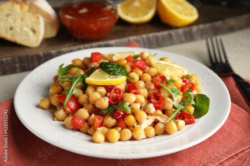 Delicious fresh chickpea salad served on table