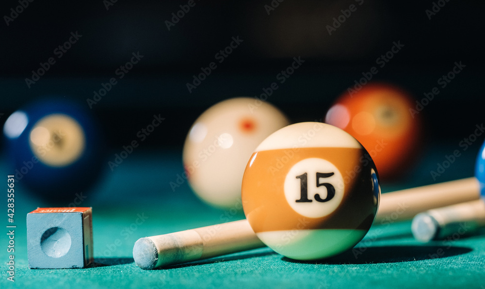 Billiard table with green surface and balls in the billiard club.Pool Game  Stock Photo | Adobe Stock