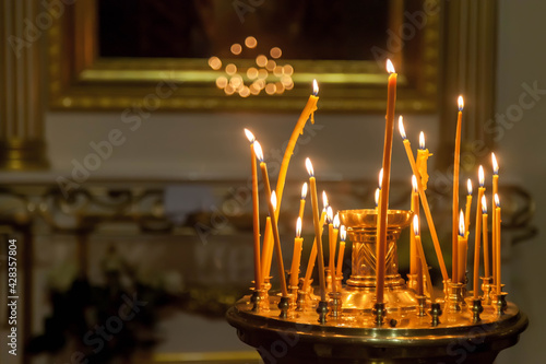 Fotografie, Obraz Many burning wax candles in orthodox church or temple for ceremony easter