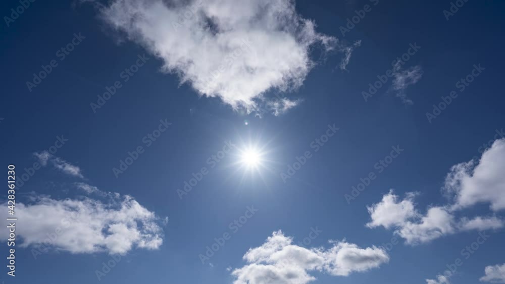 Blue sky timelapse with bright sunshine and summer clouds Blue sky timelapse with bright sunshine and summer clouds