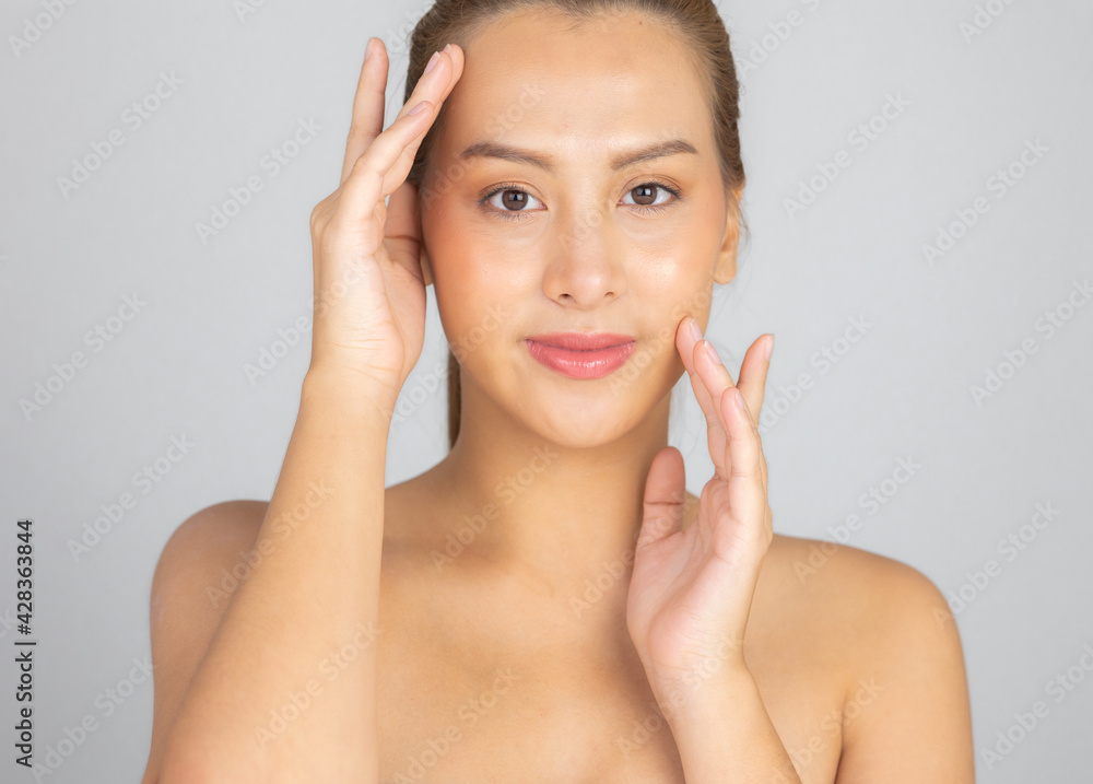 Beautiful Young Asian Woman with Clean Fresh Skin. Face care, Facial treatment, Cosmetology, beauty and healthy skin and cosmetic ideas concept. Beautiful Young Asian Woman with Clean Fresh Skin. Face care, Facial treatment, Cosmetology, beauty and healthy skin and cosmetic ideas concept.