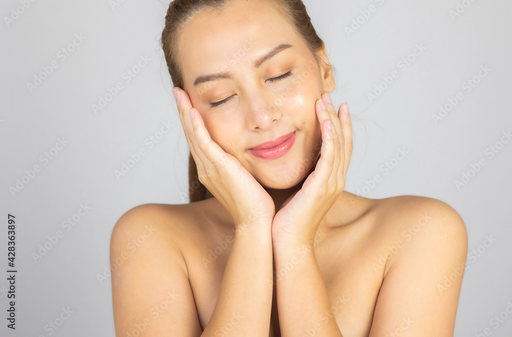 Beautiful Young Asian Woman with Clean Fresh Skin. Face care, Facial treatment, Cosmetology, beauty and healthy skin and cosmetic ideas concept. Beautiful Young Asian Woman with Clean Fresh Skin. Face care, Facial treatment, Cosmetology, beauty and healthy skin and cosmetic ideas concept.