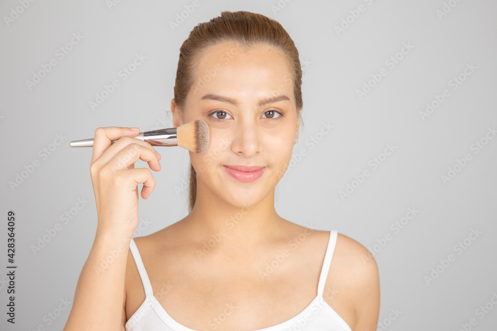 Beautiful Young Asian Woman with Clean Fresh Skin. Face care, Facial treatment, Cosmetology, beauty and healthy skin and cosmetic ideas concept. Beautiful Young Asian Woman with Clean Fresh Skin. Face care, Facial treatment, Cosmetology, beauty and healthy skin and cosmetic ideas concept.