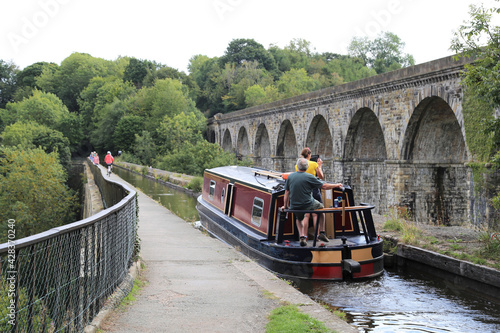 A canal boat crossing the aqueduct at Chirk, Denbighshire, Wales, UK. photo