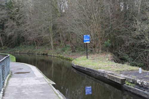 A blue sign welcoming people to England as they leave the aqueduct at Chirk, Denbighshire, Wales, UK. photo