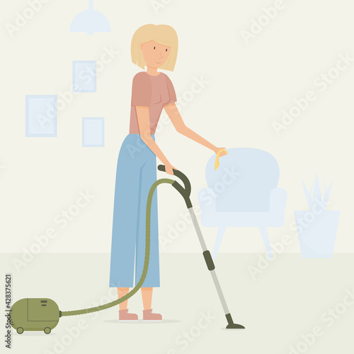 a young blonde girl with a vacuum cleaner and a rag in her hands cleans the house.