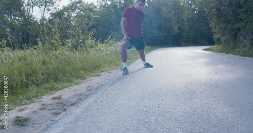 Wallpaper Mural Young man stretching his legs before running Torontodigital.ca