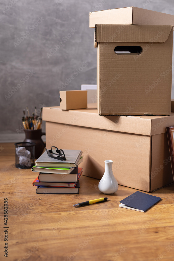 Cardboard boxes and things for moving to new home. Stack of cardboard box on floor background. Cardboard boxes and things for moving to new home. Stack of cardboard box on floor background.