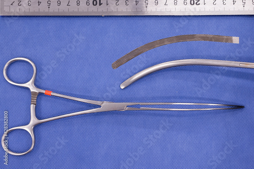 Valokuva doyen intestinal forceps on a blue background