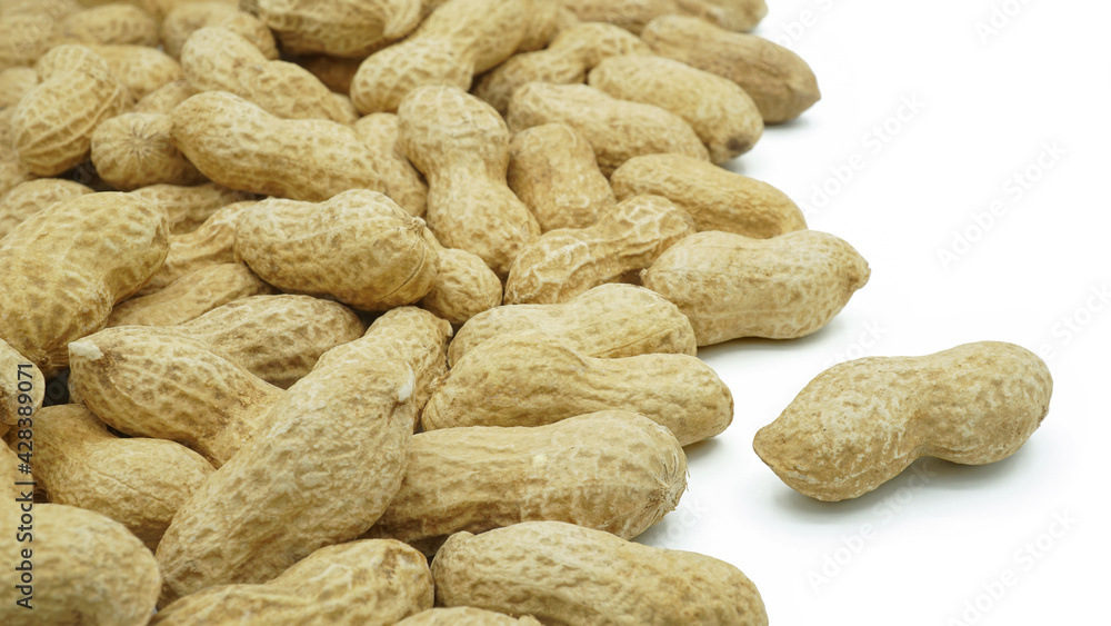 Heap of dried peanuts, Monkey nuts, Groundnuts, Isolated on white background, Close up Heap of dried peanuts, Monkey nuts, Groundnuts, Isolated on white background, Close up