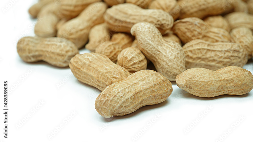 Heap of dried peanuts, Monkey nuts, Groundnuts, Isolated on white background, Close up Heap of dried peanuts, Monkey nuts, Groundnuts, Isolated on white background, Close up