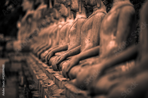 Photography Background of old Buddha statues in Thai religious attractions in Ayutthaya Province, allowing tourists to study their history and take public photos