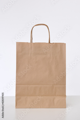 Paper bag for gifts or packaging on a white background