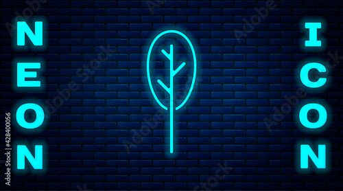 Glowing neon Spinach icon isolated on brick wall background. Vector