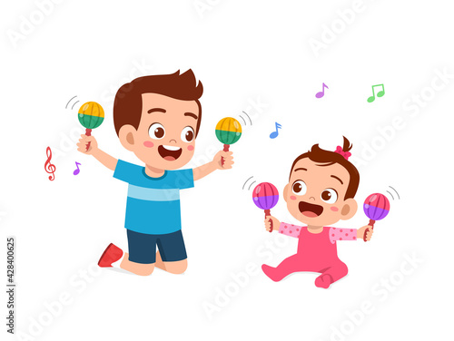 cute little boy play with baby sibling together