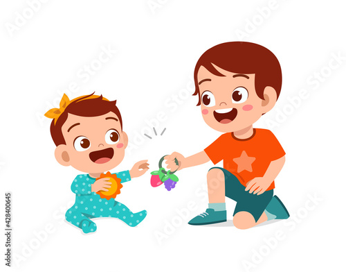 cute little boy play with baby sibling together