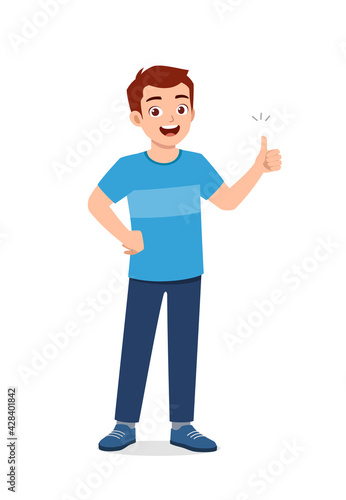 young good looking man doing thumb up pose