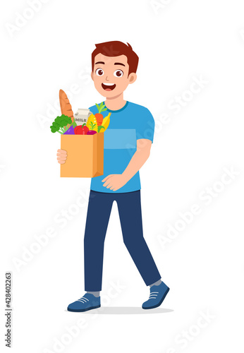 young good looking man carry bag full of grocery