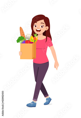 young good looking woman carry bag full of grocery