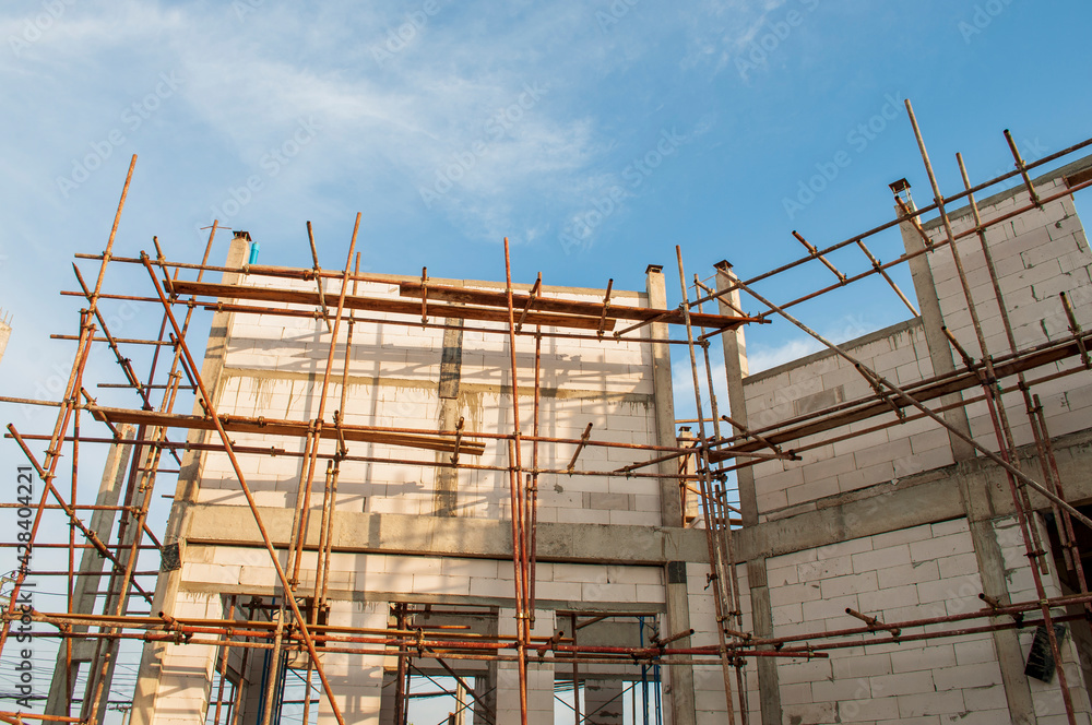 Construction of a steel scaffold on the construction site.
Construction of a steel scaffold on the construction site.