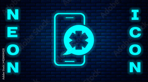 Glowing neon Emergency mobile phone call to hospital icon isolated on brick wall background. Vector