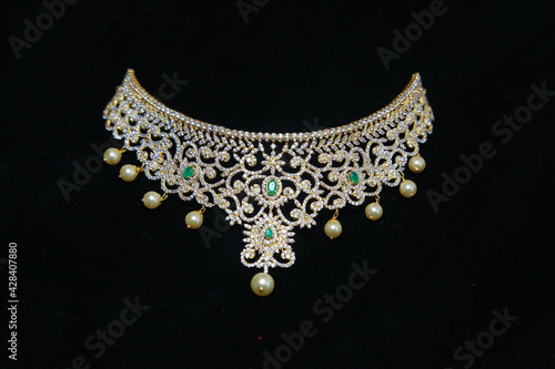 Beautiful diamond choker necklace isolated on a black background