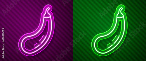 Glowing neon line Eggplant icon isolated on purple and green background. Vector