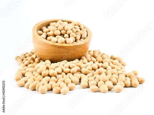 Soybeans in a wooden bowl isolated on a white background, side view with copy space for text. element of food healthy nutrients and herb vegetable ingredient concept