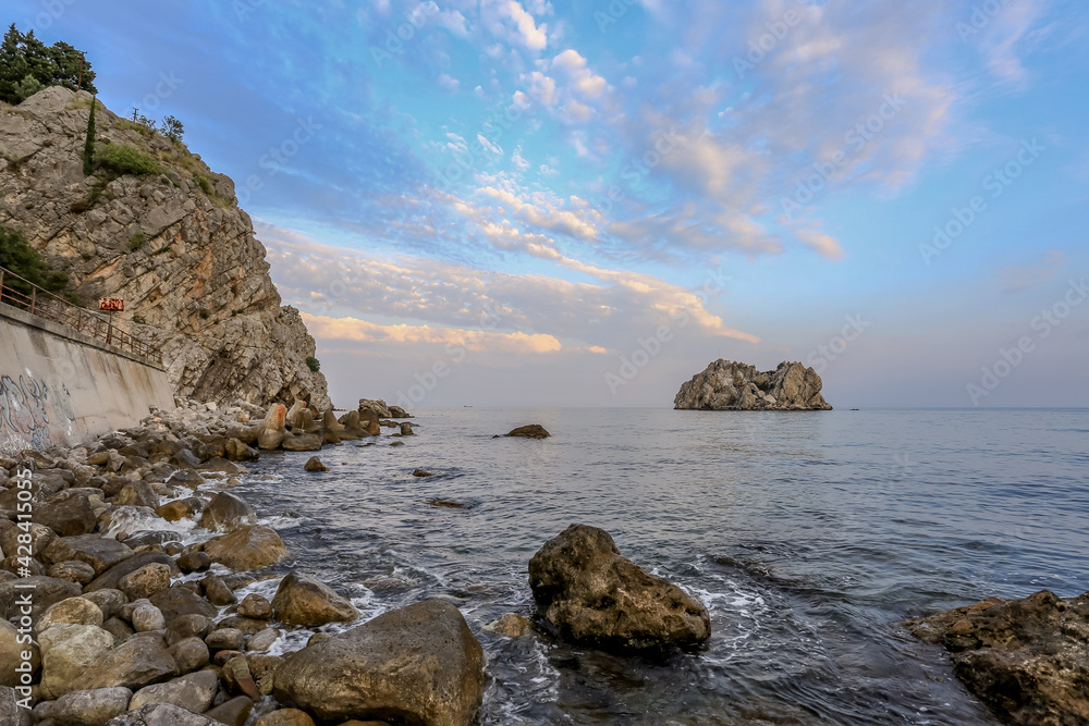 Rocks in the Crimea at sunset. Beautiful sunset on the sea. Crimean landscape. Evening on the Black Sea. Adalara rocks in Gurzuf.