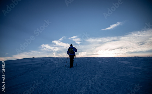 man walking on a snowy mountain