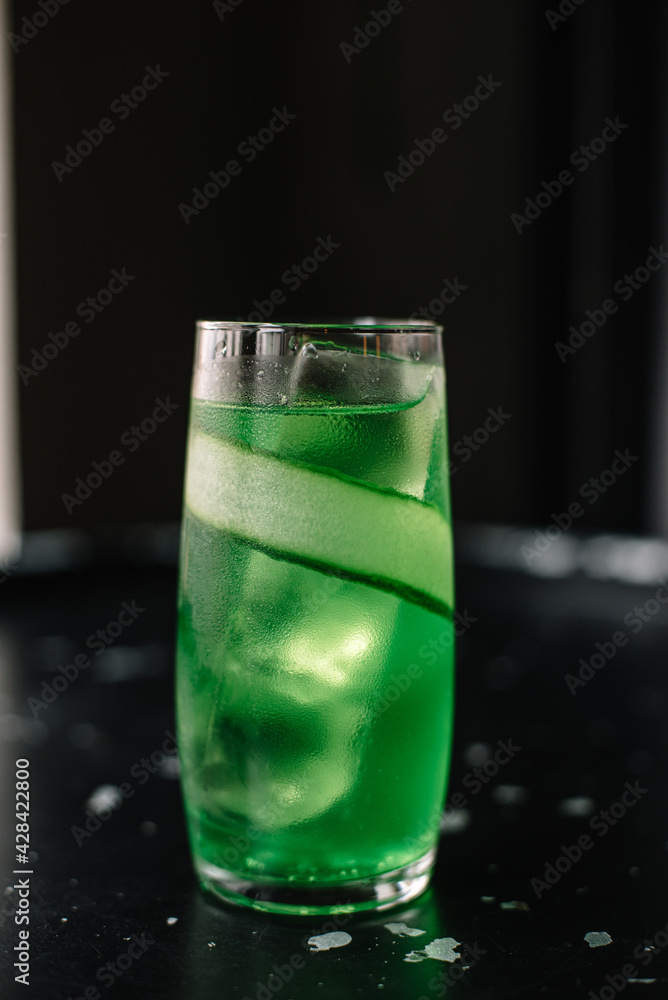 Green cocktail with cucumber and ice. Green cocktail with cucumber and ice.