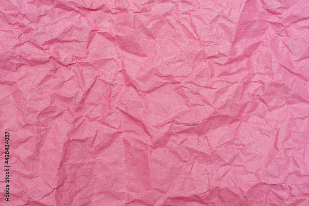 Crumpled pink background. Pink paper, texture and backgrounds. Crumpled pink background. Pink paper, texture and backgrounds.