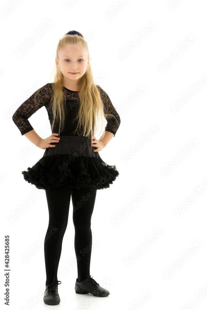 Cute little girl gymnast getting ready to perform a difficult exercise. Cute little girl gymnast getting ready to perform a difficult exercise.
