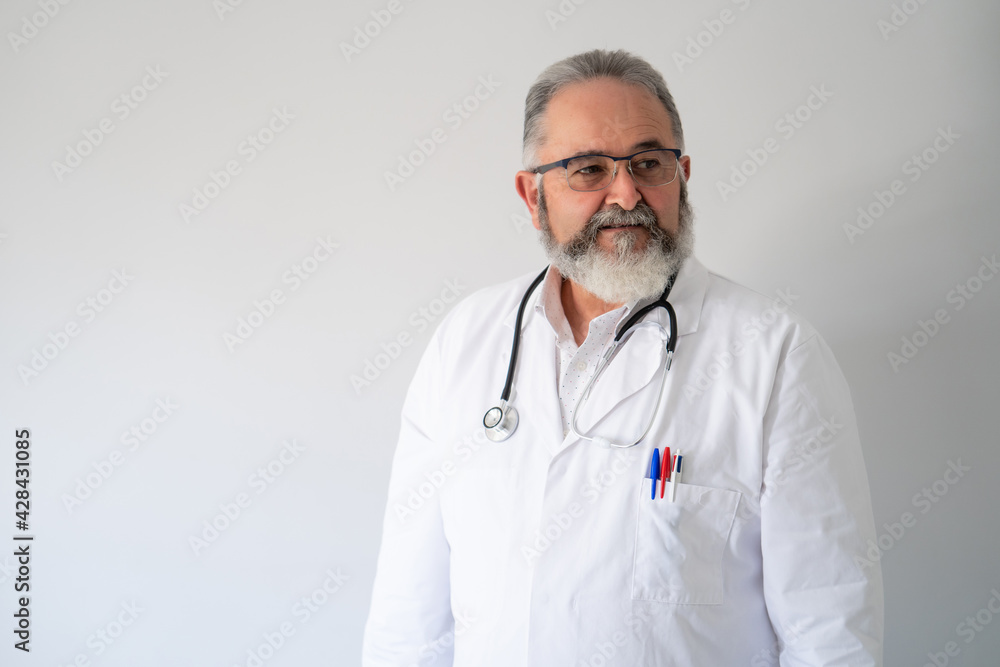 Portrait of senior doctor in white coat on white background. Portrait of senior doctor in white coat on white background.
