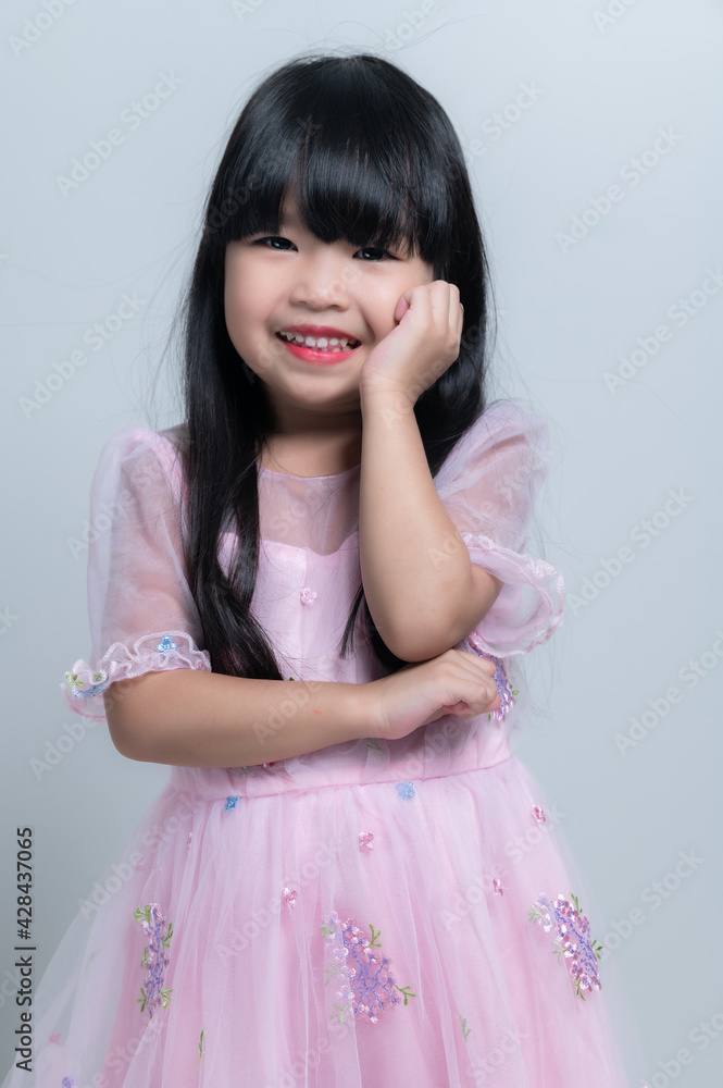 Portrait asian cute little girl pose for take a photo in studio on white background Portrait asian cute little girl pose for take a photo in studio on white background