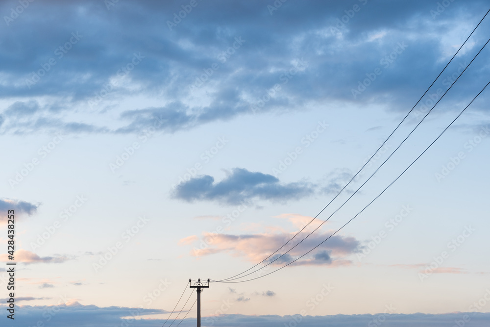 Power line support and wires on background of sunset sky Power line support and wires on background of sunset sky