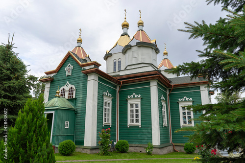 Savior Transfiguration Church in the village of Novaya Mysh, Belarus. A wooden Orthodox church built in 1859 in the pseudo-Russian style. photo